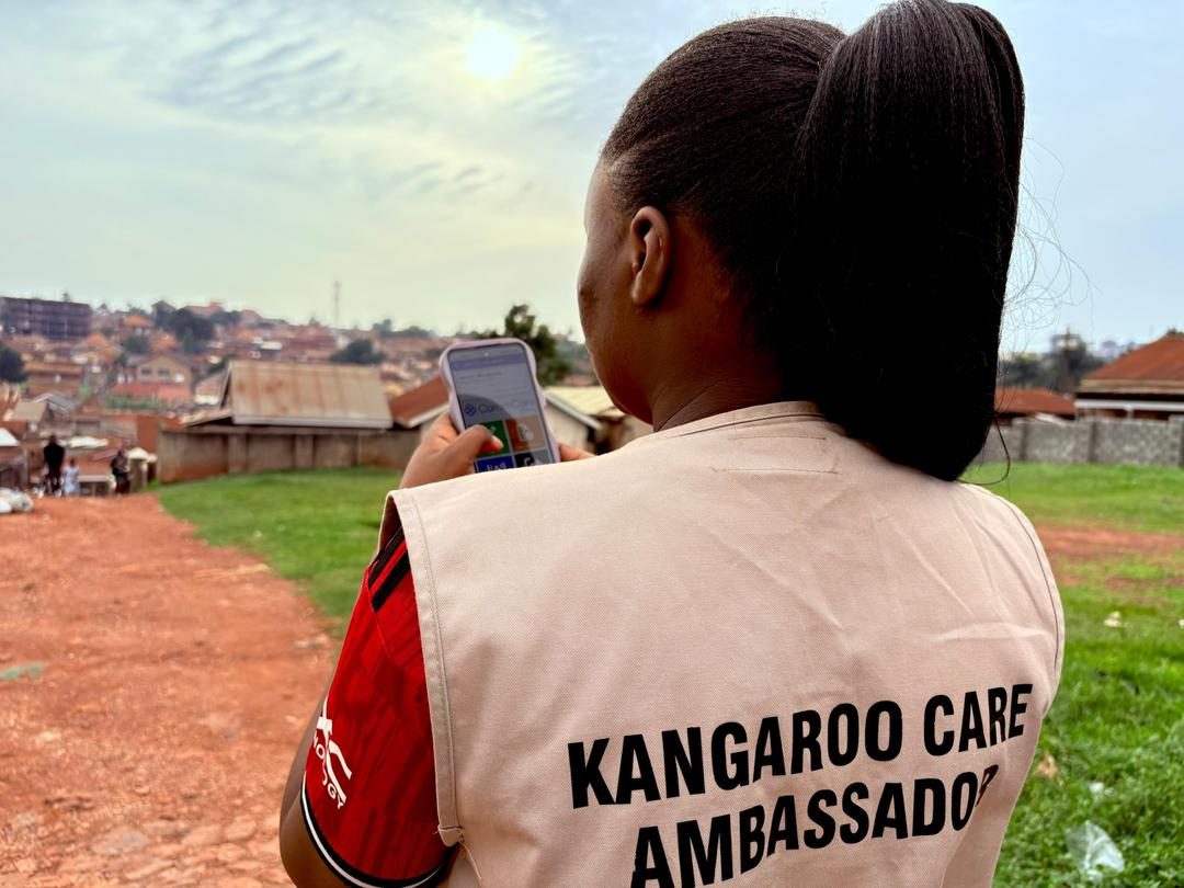 NAWEC Frontline Worker conducting a Kangaroo Care home visit with a mother and newborn in Mukono District, Uganda
